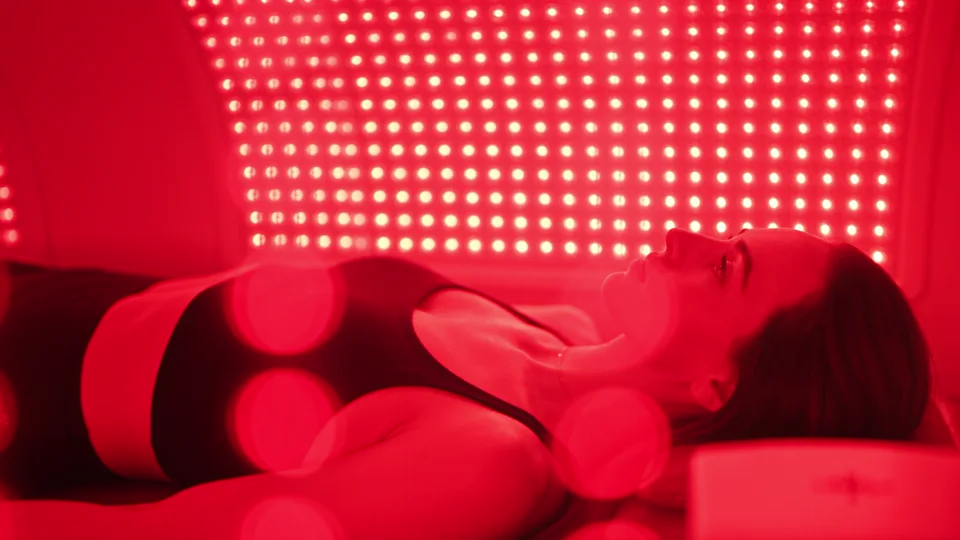 A woman resting during a red light session.