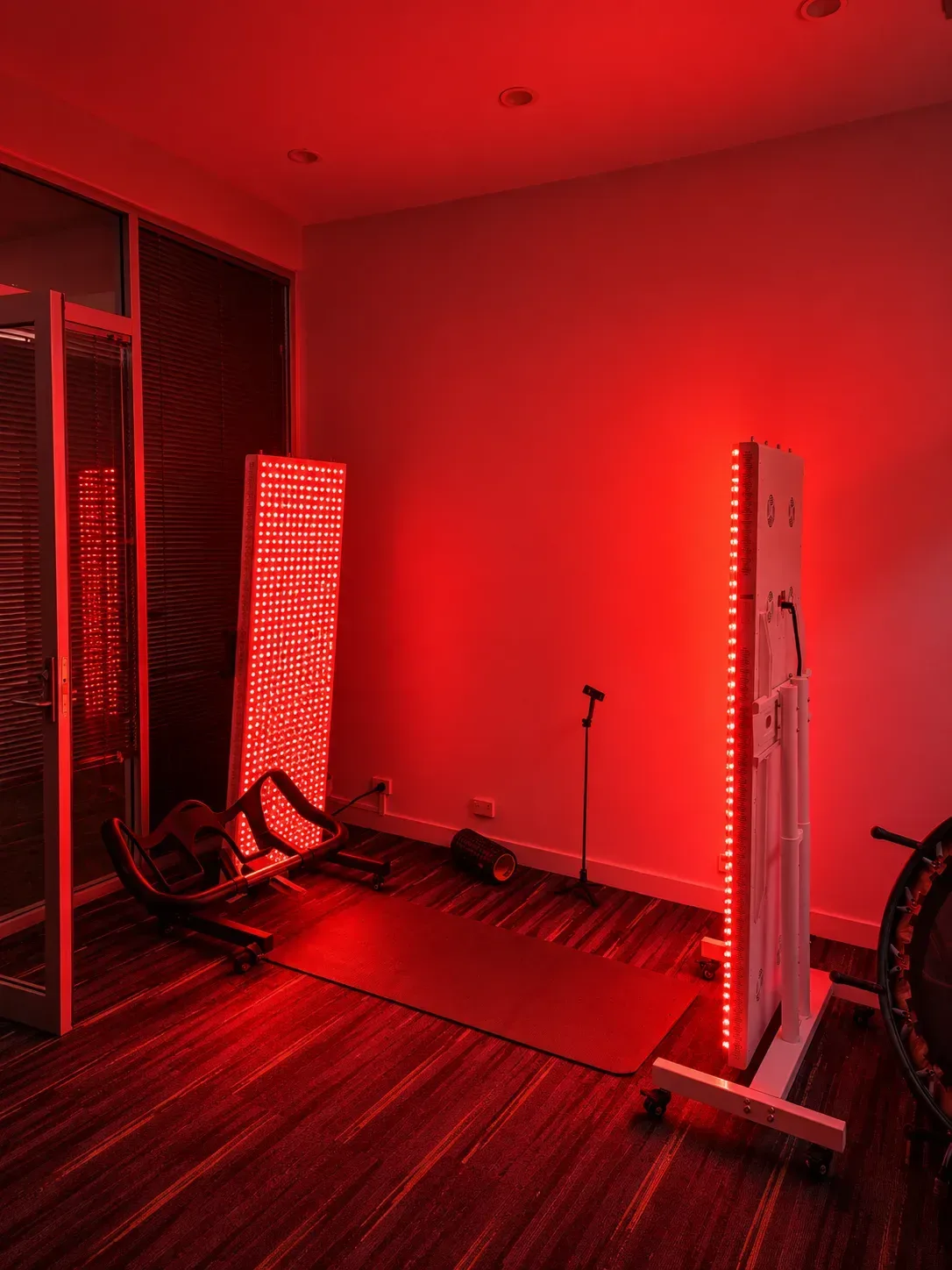 Red light panels illuminating an exercise room at the Supercell Hub.